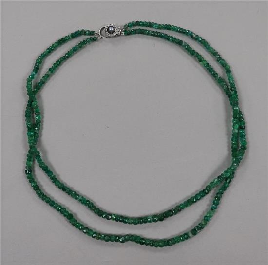 A double strand facet cut emerald bead necklace, with white metal, diamond and cultured pearl set clasp, 44cm.